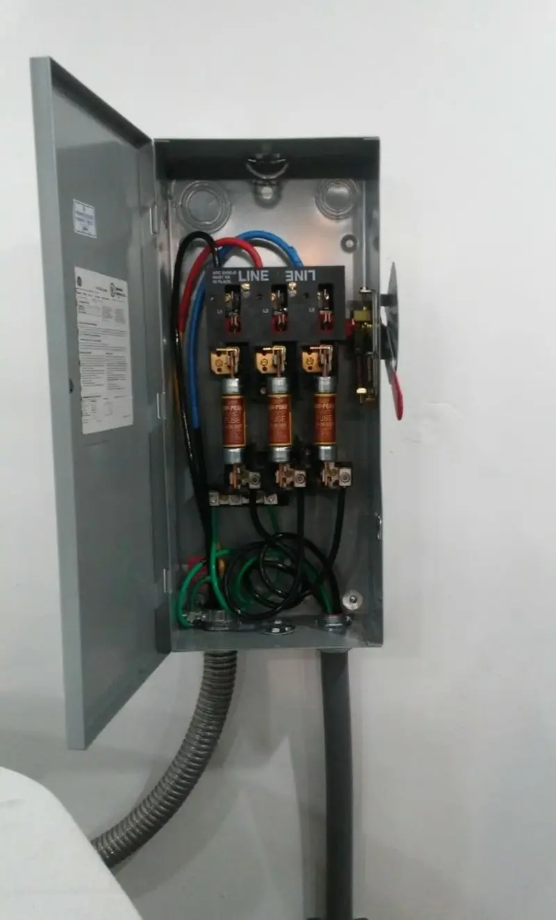Three-phase disconnect switch installed for Smoke Detector Installation in Flora